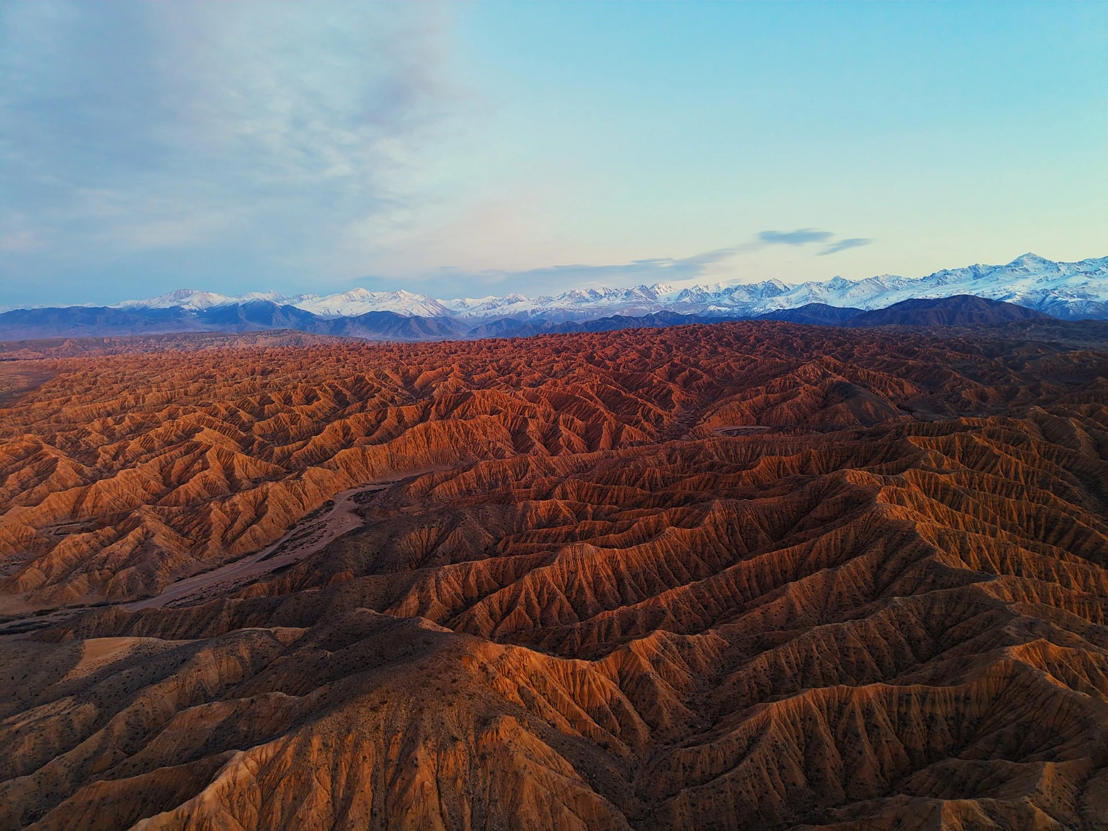 Guided photography tour at Ak-Say canyons during the golden hour, capturing the best of Kyrgyzstan's nature.