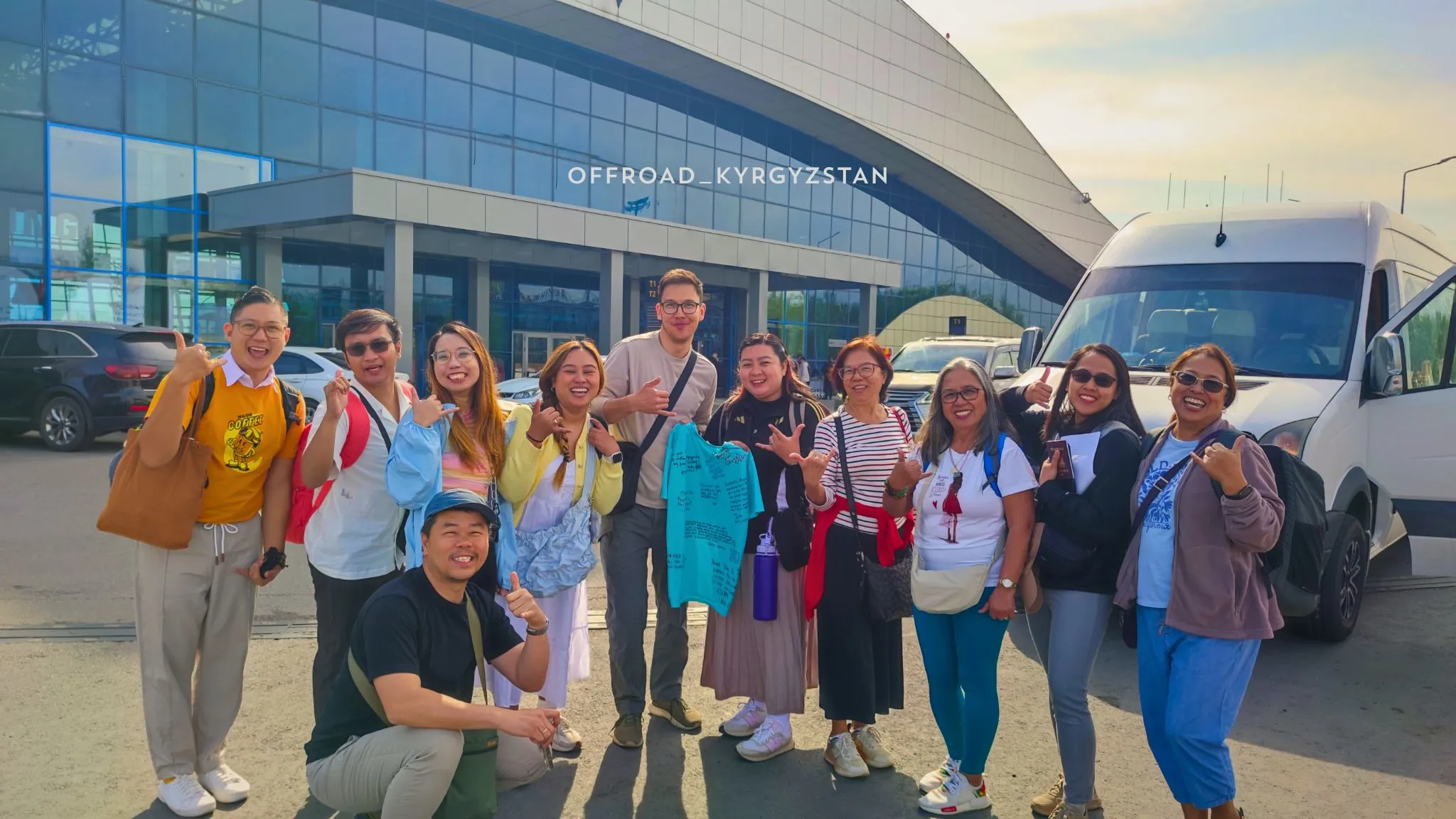 A happy Filipino travel group with their professional mountain guide after completing a 10-day tour in Kyrgyzstan.